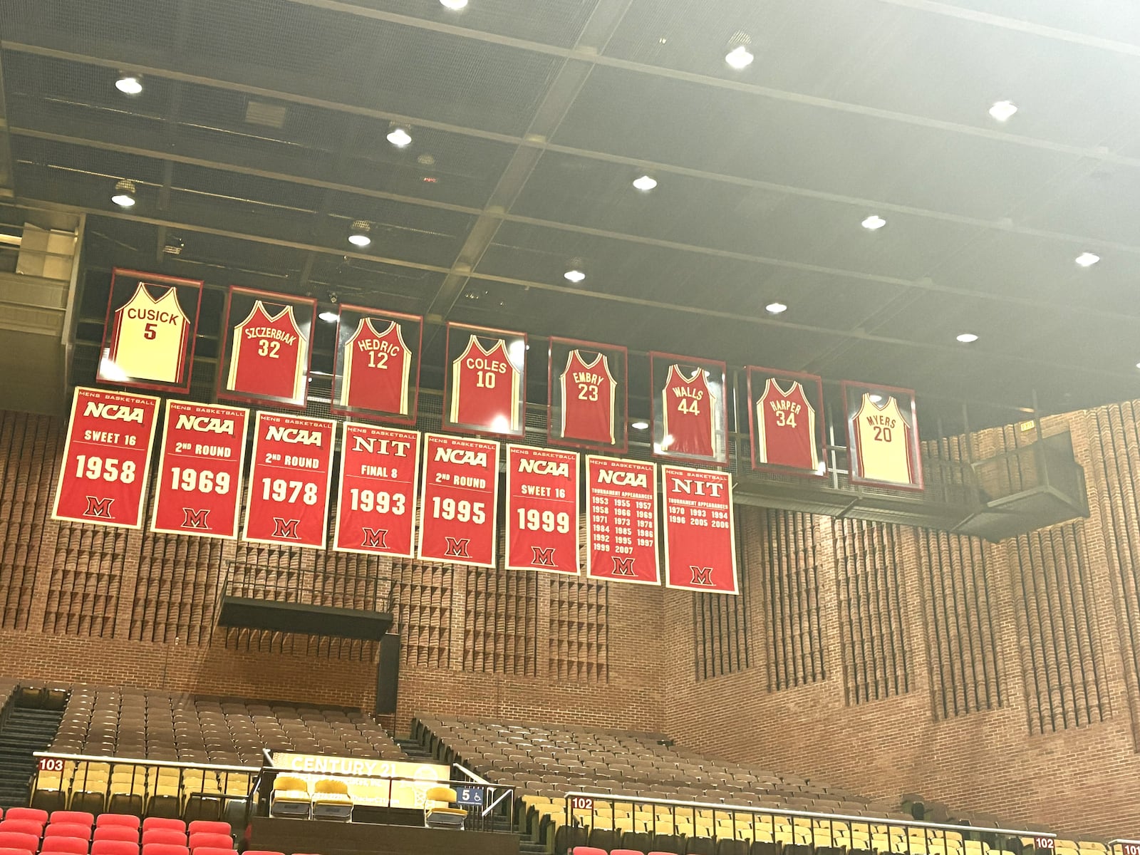 Darrell Hedric’s No. 12 jersey (he also wore No. 86) is one of the eight jerseys of Miami greats that the school has retired and hung in honor from the rafters of Millett Hall. TOM ARCHDEACON / CONTRIBUTED PHOTO