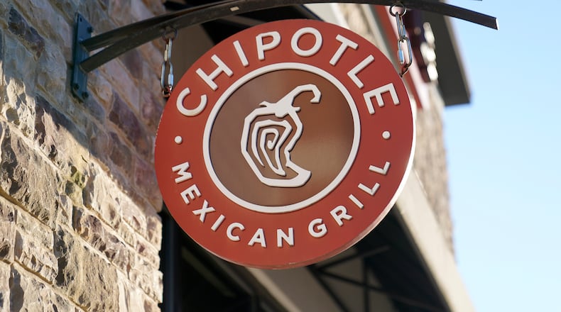 The Chipotle Mexican Grill logo hangs outside a restaurant location, Dec. 20, 2022, in Westwood, Mass. (AP Photo/Steven Senne, File)