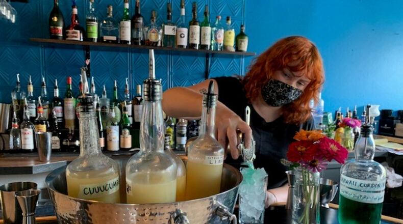 Lily's Bistro in Dayton's Oregon District is finishing its transformation to Lily's Dayton. The new concept, "Good Food, Tasty Cocktails," will blend some of Lily's familiar favorites with a more affordable menu and cocktail list and offers a tiki-inspired theme. ALEXIS LARSEN/CONTRIBUTED PHOTOS