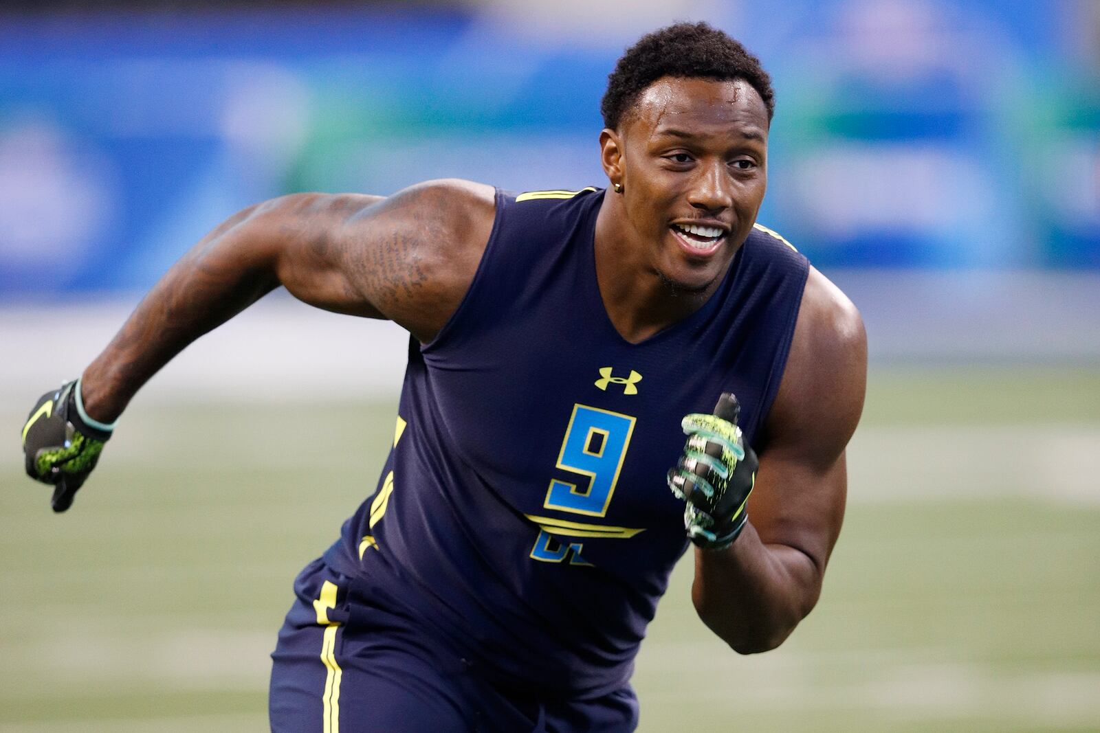 INDIANAPOLIS, IN - MARCH 05: Defensive lineman Taco Charlton of Michigan participates in a drill during day five of the NFL Combine at Lucas Oil Stadium on March 5, 2017 in Indianapolis, Indiana. (Photo by Joe Robbins/Getty Images)