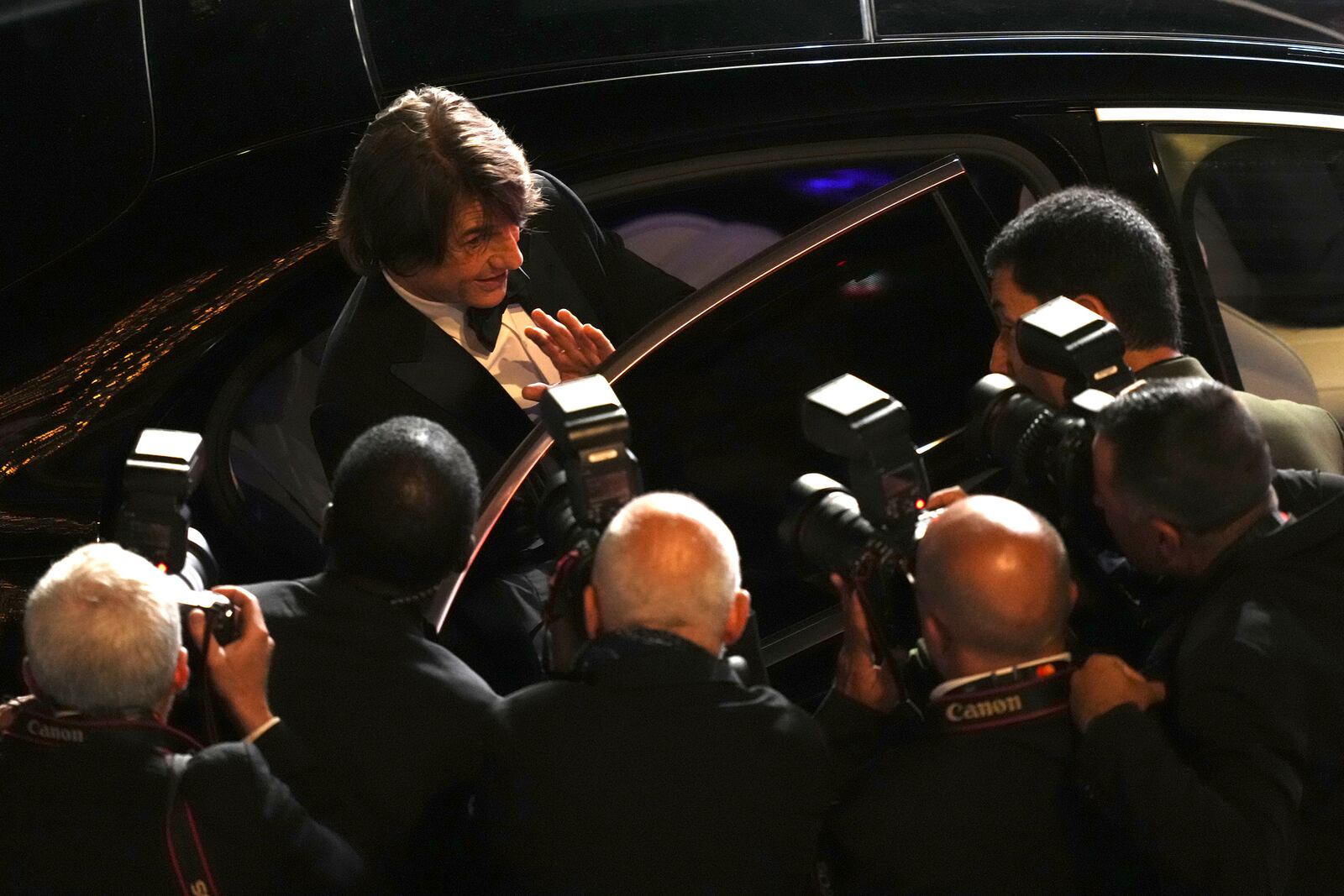 Tom Cruise poses for photographers upon departure from the premiere of the film 'Mission: Impossible – The Final Reckoning' at the 78th international film festival, Cannes, southern France, Wednesday, May 14, 2025. (Photo by Lewis Joly/Invision/AP)