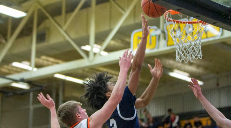 Fairmont's Jamison Rountree scores two of his team-high 19 points Tuesday night against Beavercreek. CONTRIBUTED/Jeff Gilbert