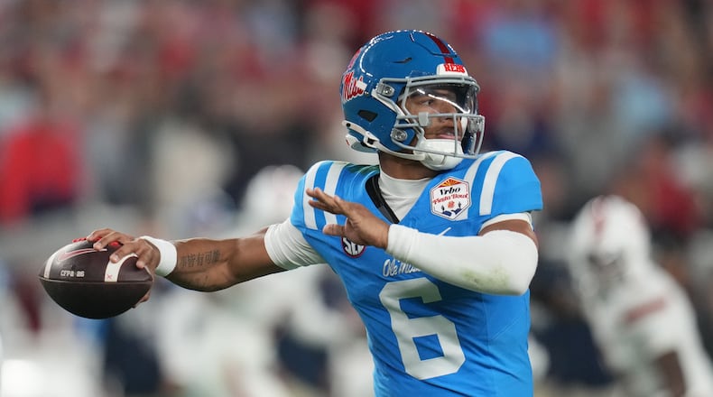 Mississippi quarterback Trinidad Chambliss throws during the first half of the Fiesta Bowl NCAA college football playoff semifinal game against Miami, Thursday, Jan. 8, 2026, in Glendale, Ariz. (AP Photo/Rick Scuteri)