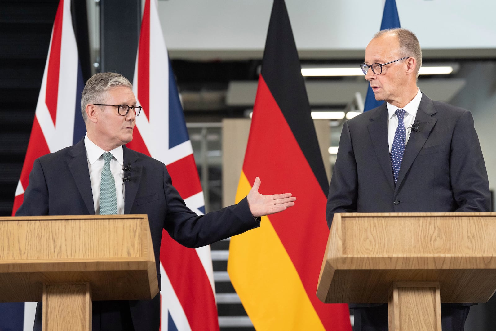 Britain's Prime Minister Keir Starmer, left, and German Chancellor Friedrich Merz hold a press conference during a visit to the Airbus factory in Stevenage, England, Thursday July 17, 2025. (Stefan Rousseau/Pool via AP)