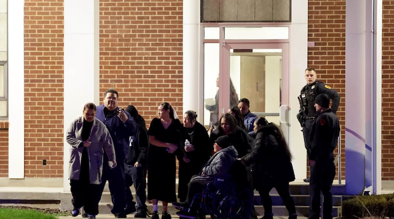People attending a funeral at the The Church of Jesus Christ of Latter-day Saints in Salt Lake City leave after a fatal shooting in the parking lot Wednesday, Jan. 7, 2025. (Laura Seitz/The Deseret News via AP)