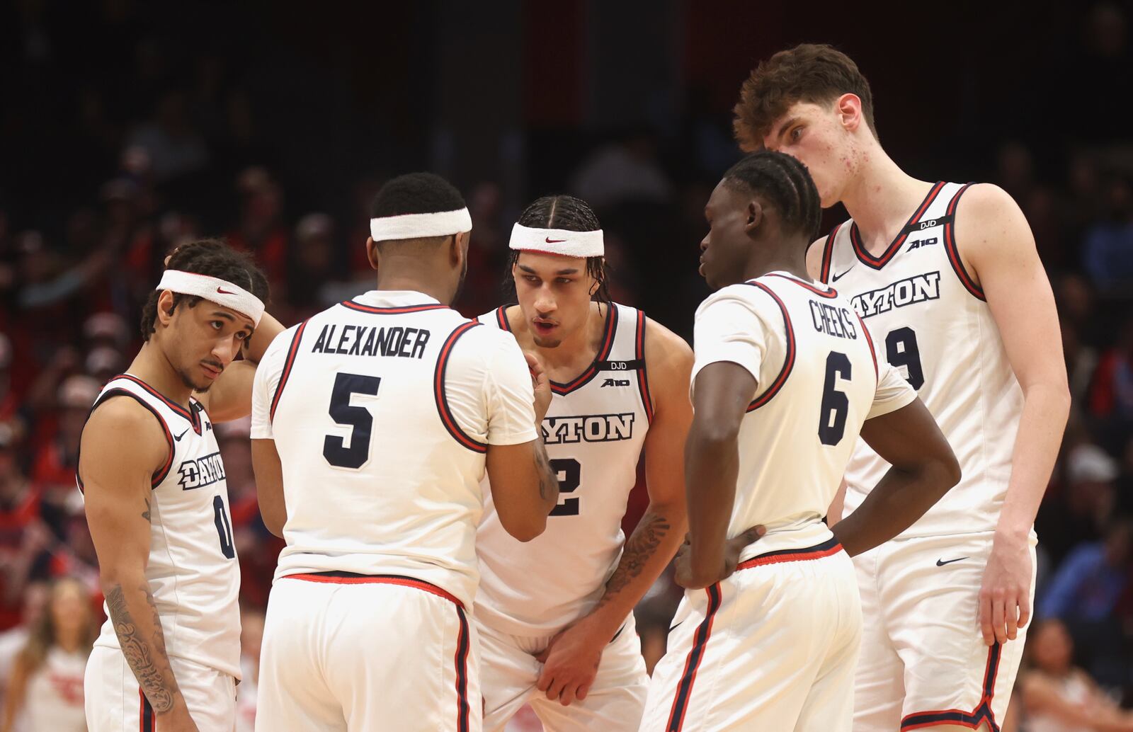 Dayton's starters huddle in the second half against Davidson on Tuesday, Feb. 4, 2025, at UD Arena.. David Jablonski/Staff