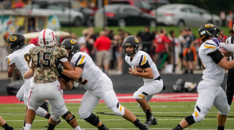 Centerville quarterback Chase Harrison carries the ball during their season opener football game against Fairfield Friday, August 30 in Fairfield. Farifield won 33-7. NICK GRAHAM/STAFF