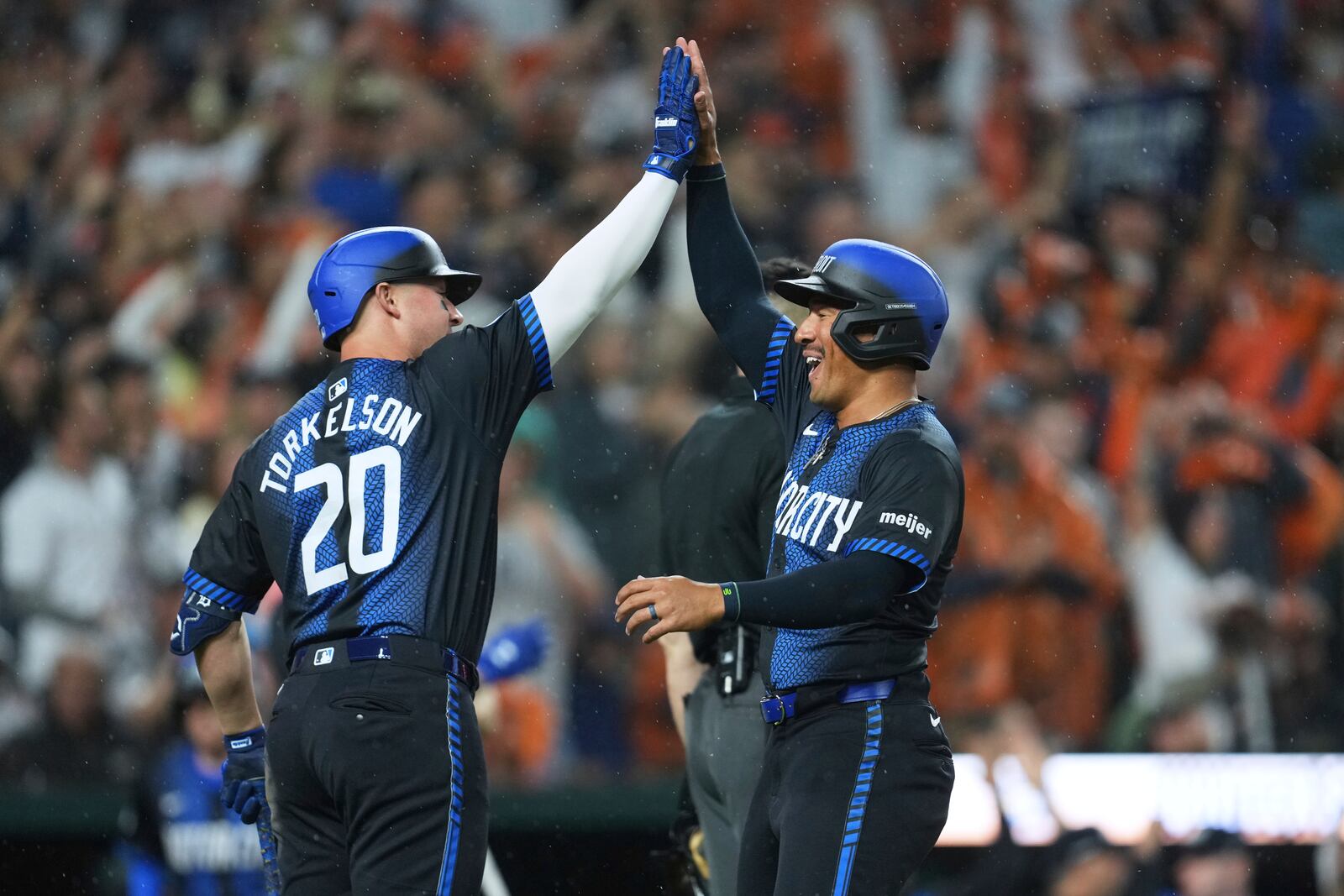 Detroit Tigers' Jahmai Jones, right, celebrates scoring with Spencer Torkelson (20) against the Cincinnati Reds in the sixth inning during a baseball game, Friday, June 13, 2025, in Detroit. (AP Photo/Paul Sancya)