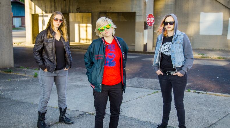 The members of punk trio Jasper The Colossal, (left to right) Sarah Kouse, Paige Beller and Moriah Yux, organized an all-ages benefit for Have A Gay Day at Yellow Cab Tavern in Dayton on Saturday, Sept. 24.