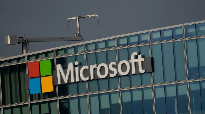 FILE - The logo of Microsoft is seen outside its French headquarters in Issy-les-Moulineaux, outside Paris on May 13, 2024. (AP Photo/Thibault Camus, File)