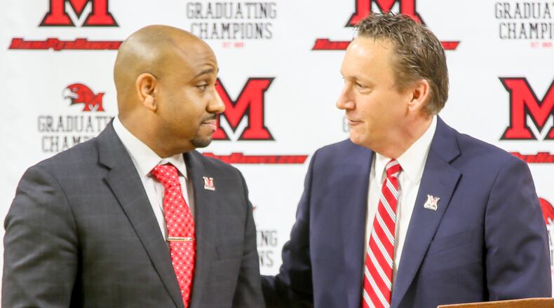 Jack Owens, the new Miami University head basketball coach, is introduced by David Sayler, Miami University Athletic Director, during a public event at Millett Hall in Oxford, Thursday, Mar. 30, 2017. GREG LYNCH / STAFF