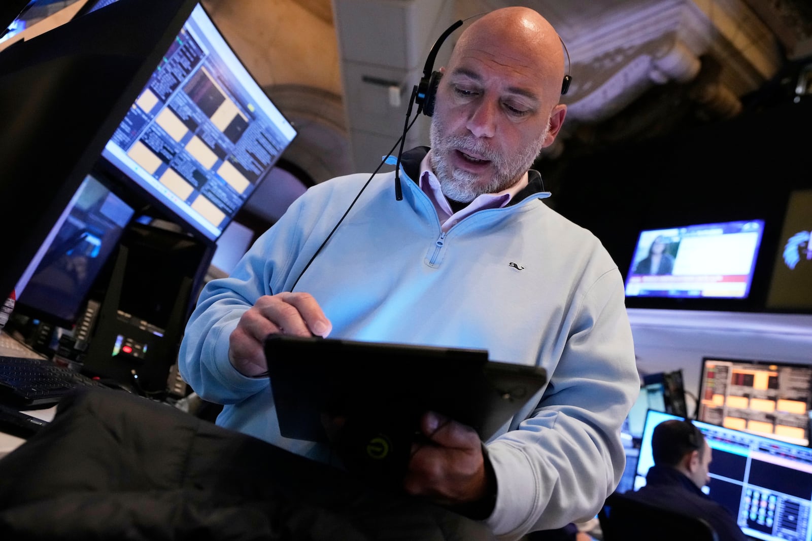 Trader Vincent Napolitano works on the floor of the New York Stock Exchange, Friday, April 4, 2025. (AP Photo/Richard Drew)