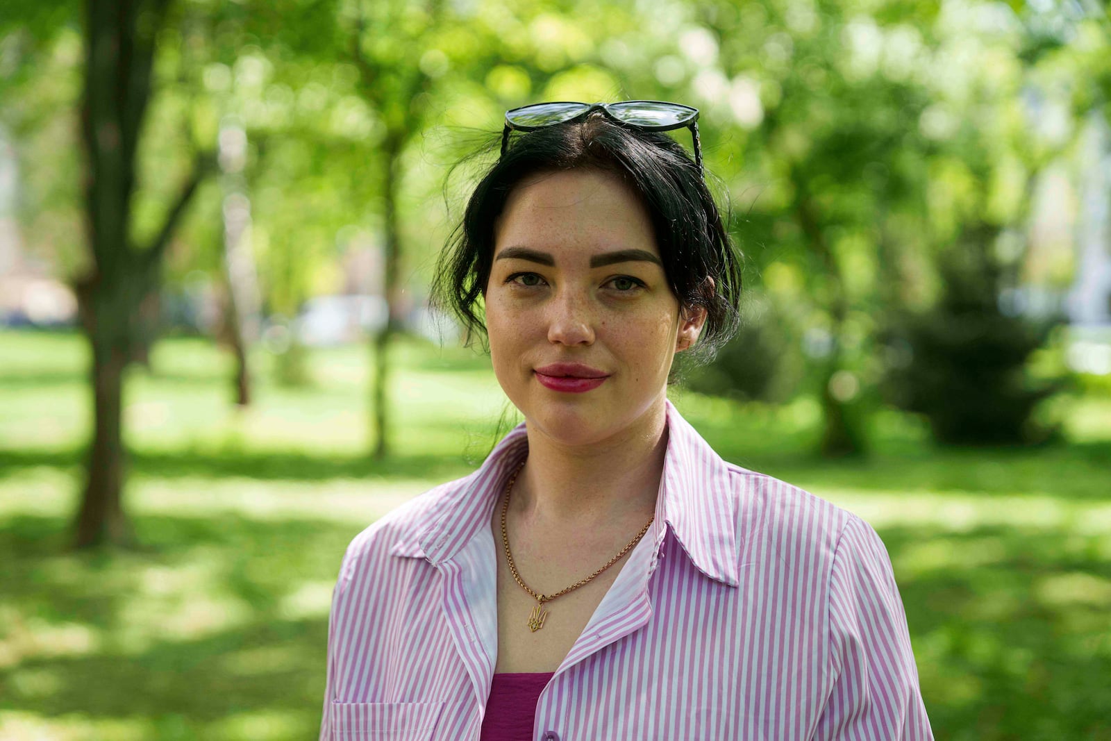 Olha Kurtmalaieva stands in a park in Kyiv, Ukraine, on Wednesday, April 23, 2025. (AP Photo/Evgeniy Maloletka)
