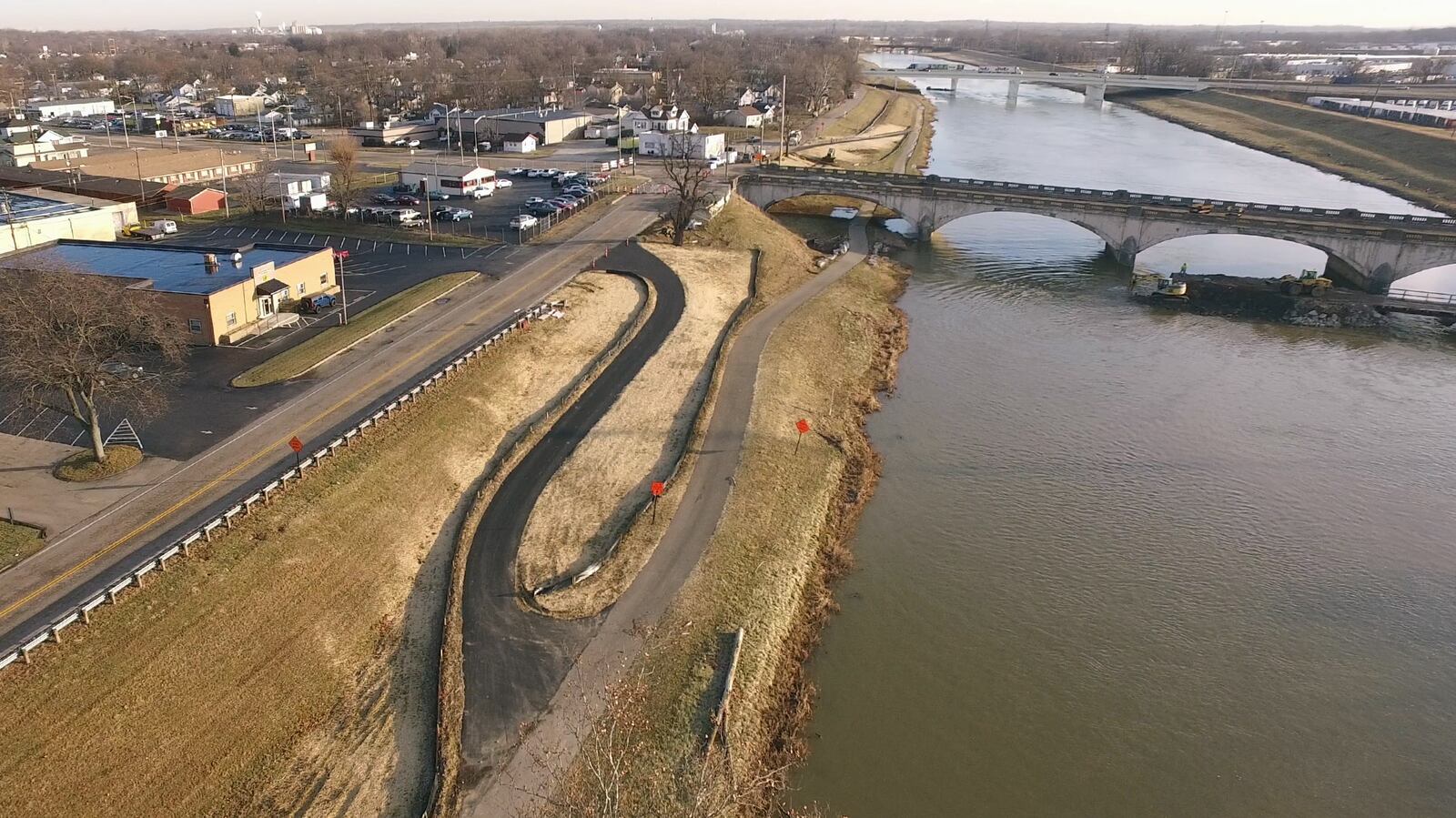 Contractors have completed a detour for users of the Great Miami River Recreational Trail on the north side of the Keowee Street Bridge.  The bridge was closed to traffic in December and the Eagle Bridge Company is preparing to demolish the 81-year-old structure and rebuild a new bridge over the next two years.  The Great Miami River Recreational Trail passes under the north side of the Keowee Street Bridge along the river.  The short detour of the Great Miami River Recreational Trail ramps up to Embury Park Road and crosses North Dixie Drive on the north side of the bridge with a length of about one thousand feet.   TY GREENLEES / STAFF