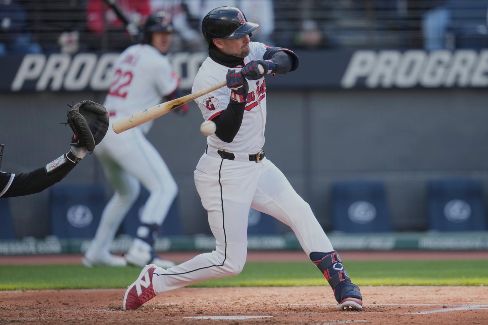 Cleveland Guardians' Lane Thomas is hit by a pitch in the fifth inning of a baseball game against the Chicago White Sox in Cleveland, Tuesday, April 8, 2025. (AP Photo/Sue Ogrocki)