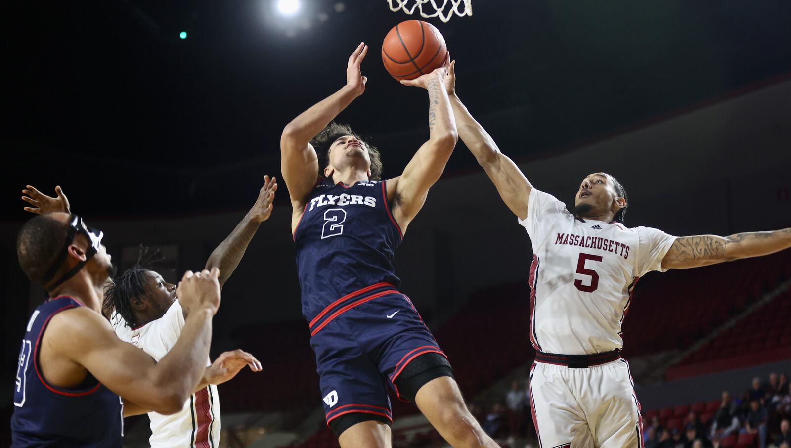 Dayton's Nate Santos shoots against Massachusetts on Wednesday, Jan. 8, 2025, at the Mullins Center in Amherst, Mass. David Jablonski/Staff