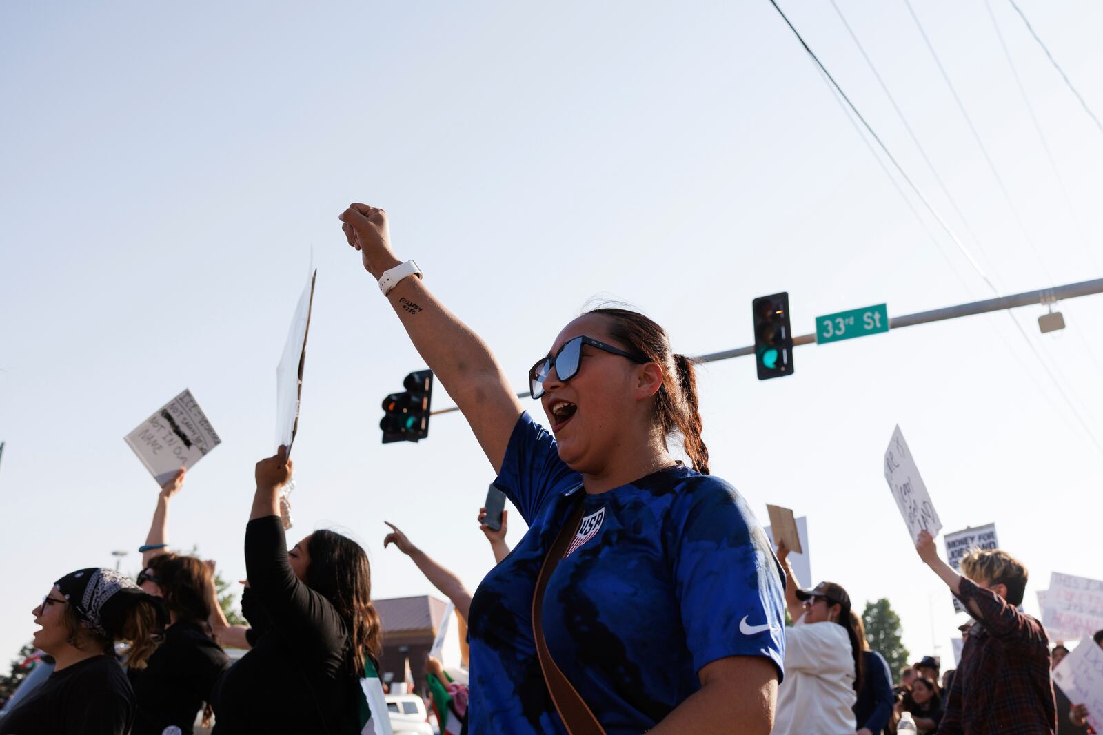 Hundreds gather in after U.S. Immigration and Customs Enforcement conducted a raid earlier in the day in Omaha, Neb. on Tuesday, June 10, 2025. (Nikos Frazier/Omaha World-Herald via AP)