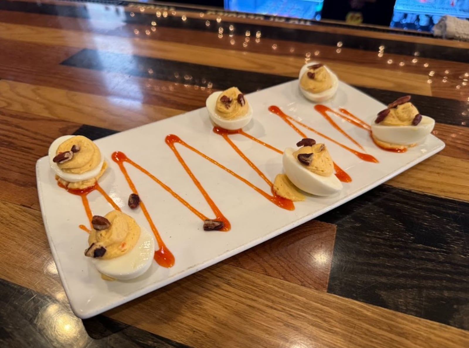 The Swire Inn’s most talked-about menu items is its deviled egg appetizer. These eggs are anything but traditional, rotating through inventive flavors such as Pad Thai, Skyline chili and hot honey peach. NINA WEIERMAN/CONTRIBUTED