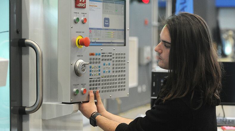 Greene County CTC student Kaden Gillespie works with a HAAS machine at the center, Monday, April 1, 2024. MARSHALL GORBY\STAFF