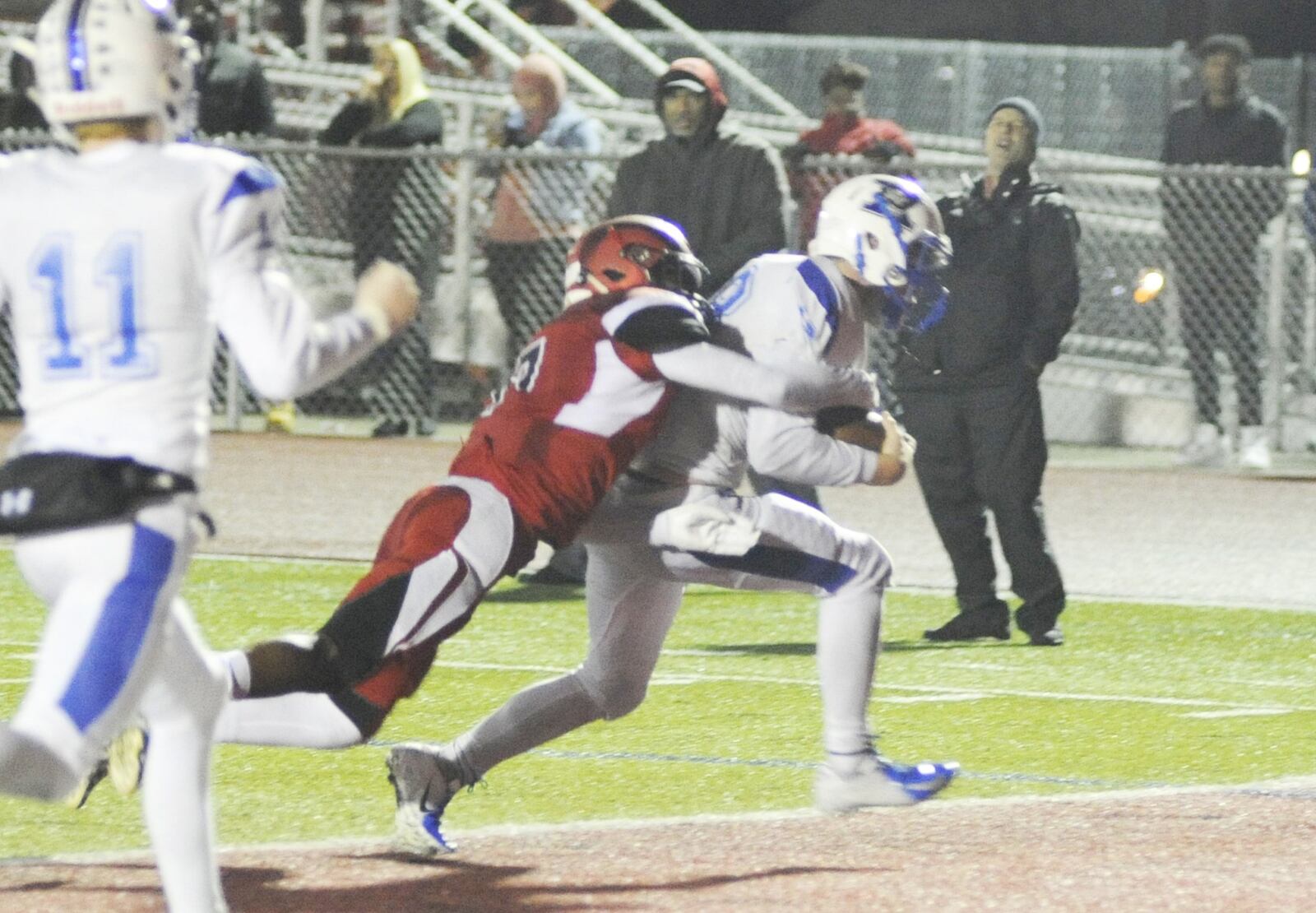Xenia’s Nick Willis (right) secures the winning 2-point pass conversion. Xenia defeated host Trotwood-Madison 29-28 in double OT in a Week 9 high school football game on Friday, Oct. 19, 2018. MARC PENDLETON / STAFF