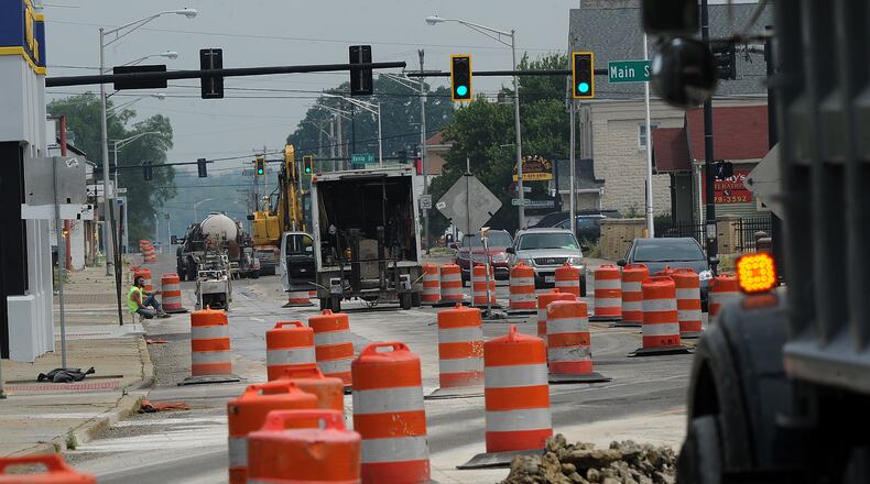 Drivers maneuver through orange traffic barrels Tuesday, June 6, 2023 in Fairborn as construction has started on Ohio 444 near Wright-Patterson Air Force Base. MARSHALL GORBY\STAFF