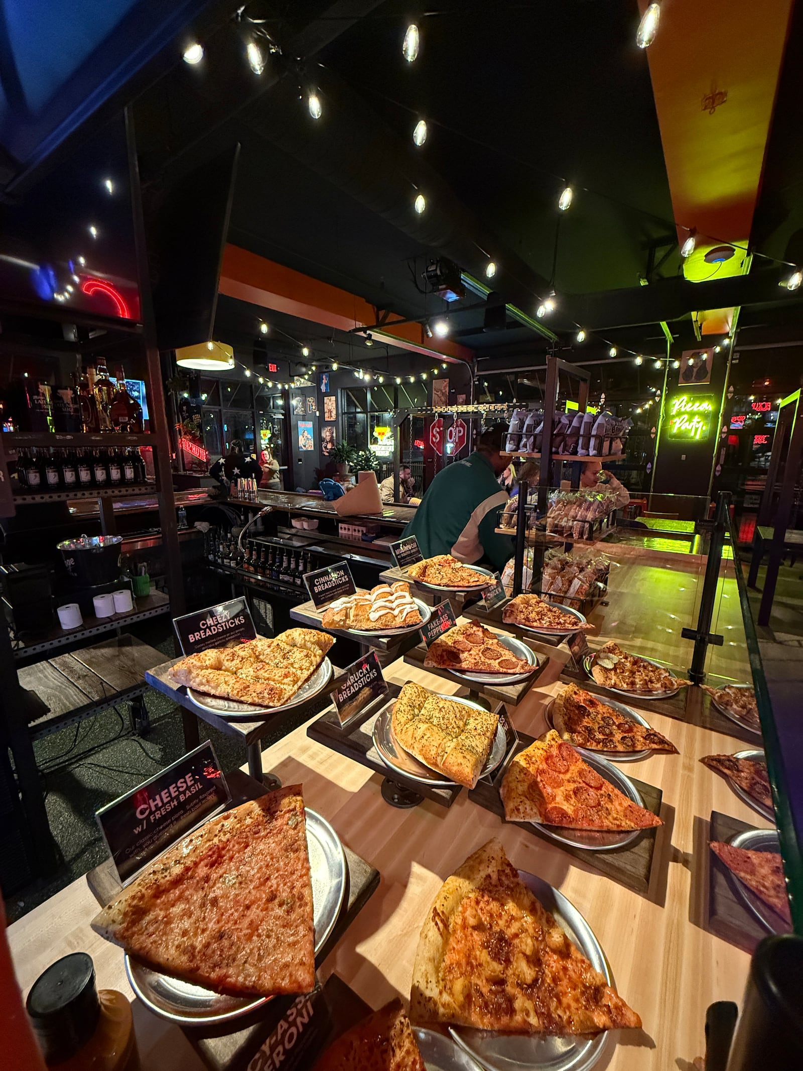 Mikey’s Late Night Slice has set menu with fan favorites like Plain-Ass Pepperoni, Spicy-Ass Pepperoni, Vegan Fake-Ass BBQ Chick’n, Vegan Fake-Ass Pepperoni, The Garbàge and The Weggie, guests can expect new specialty pies every two weeks. CONTRIBUTED