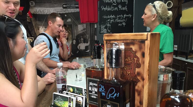 Visitors at Key West First Legal Rum Distillery sample the wares. (Lori Rackl/Chicago Tribune/TNS)