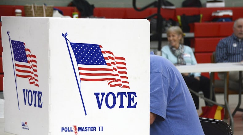 A Fairfield Twp. resident casts his Election Day vote on Tuesday, Nov. 6, 2018, at Fairfield North Elementary School.