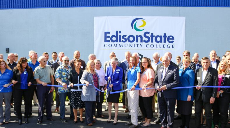 Edison State President Dr. Doreen Larson, along with supporters of Edison State, cut the ribbon to the newest Edison State campus located in Troy.