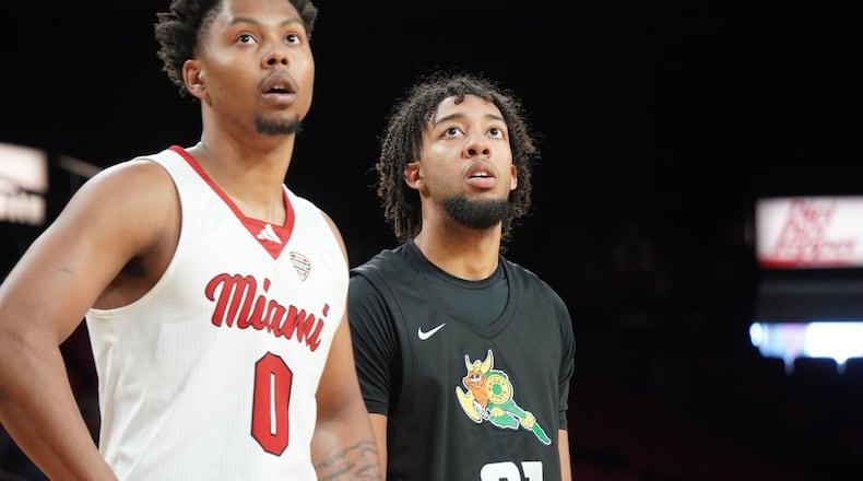 Wright State's Logan Woods (21) and Miami's Eian Elmer (0) watch a free throw during a game earlier this season at Millett Hall. Woods scored a career-high 18 points Thursday in the Raiders' win over Princeton in the Myrtle Beach Invitational. Chris Vogt/CONTRIBUTED