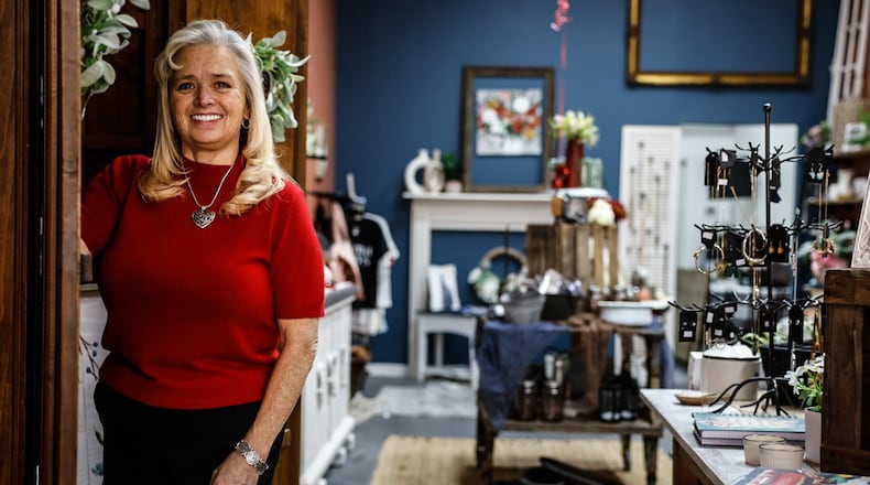 Cathy Ball is the owner of the Cozy Corner, which opened earlier this month on Main Street in downtown Miamisburg. Ball sells home decor, fashion jewelry and vintage furniture. JIM NOELKER/STAFF