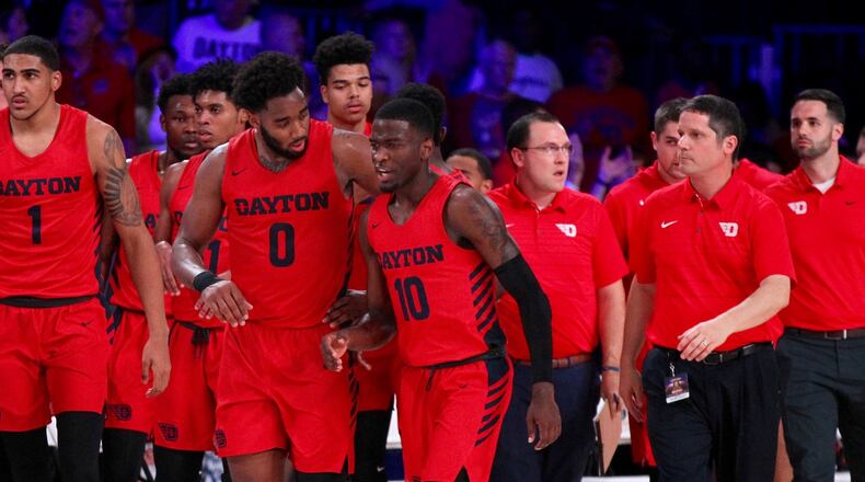 Dayton players, including Josh Cunningham and Jalen Crutcher, leave the court at halftime of a game against Butler in the first round of the Battle 4 Atlantis on Wednesday, Nov. 21, 2018, at Imperial Gym on Paradise Island, Bahamas. David Jablonski/Staff