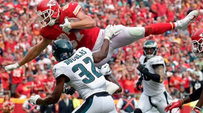 Kansas City Chiefs tight end Travis Kelce (87) leaps over Philadelphia Eagles cornerback Rasul Douglas (32) for a touchdown during the second half of an NFL football game in Kansas City, Mo., Sunday, Sept. 17, 2017. (AP Photo/Ed Zurga)