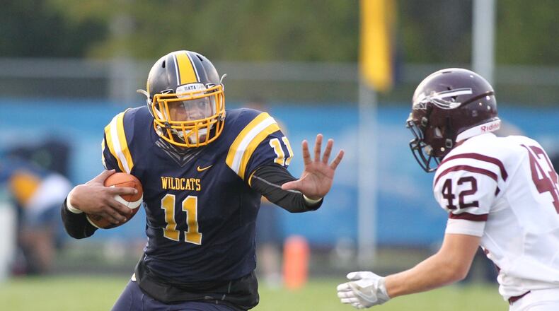 Springfield’s Leonard Taylor runs against Lebanon’s Zach Edwards on Friday, Sept. 23, 2016, at Evans Stadium in Springfield. David Jablonski/Staff