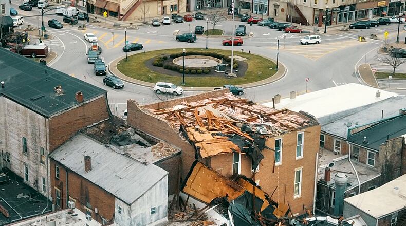 A building at N. Market and E. Main St. on Troy's downtown square lost its roof during a January 2020 EF0 tornado lasting two minutes. LISA POWELL / STAFF