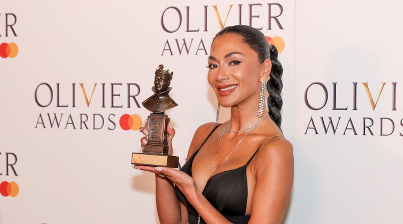 Nicole Scherzinger, winner of the best actress in a musical award for "Sunset Boulevard", poses for photographers in the winner's room during the Olivier Awards on Sunday, April 14, 2024, in London. (Photo by Vianney Le Caer/Invision/AP)