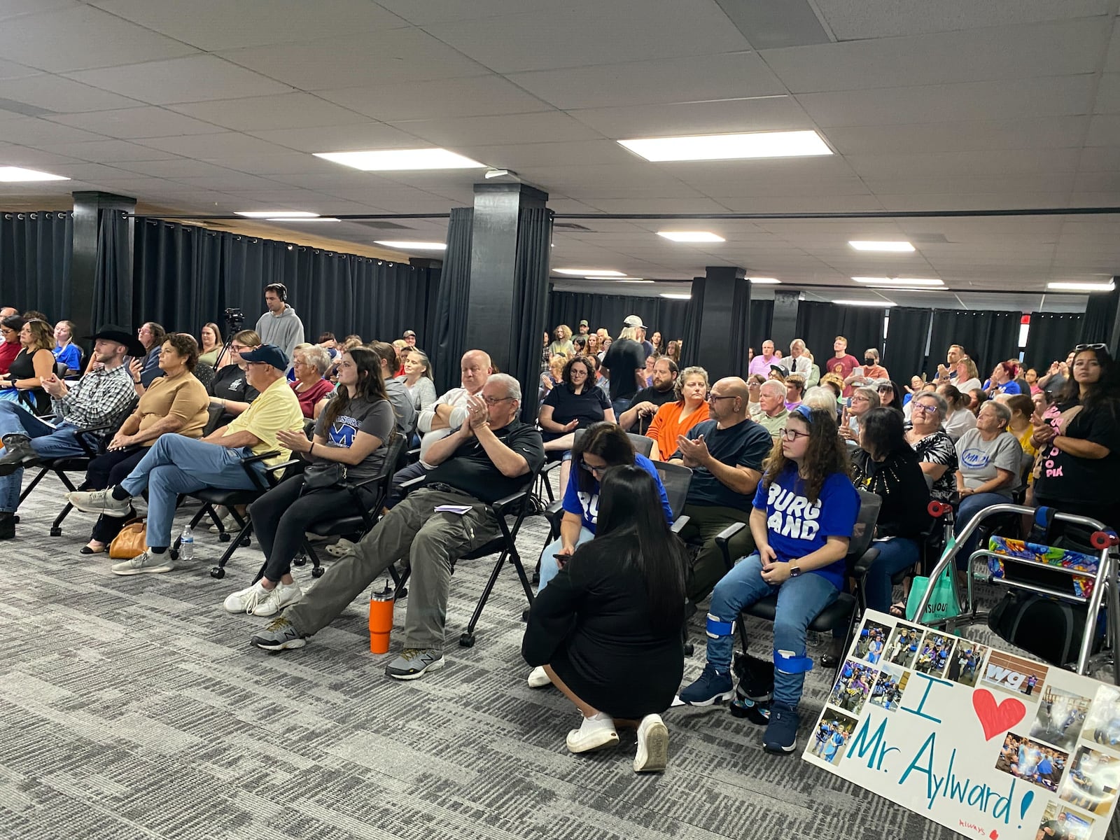 A crowd of more than 100 people packed Miamisburg School District's Board of Education meeting Thursday, Sept. 18, 2025 after two teachers were placed on paid leave for remarks concerning conservative political figure Charlie Kirk. More than a dozen students, parents and alumni voiced support of music teacher/band director Steve Aylward. ERIC SCHWARTZBERG/STAFF