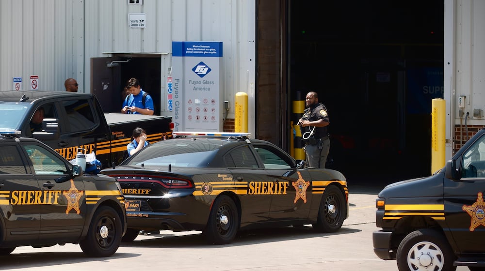 Several Montgomery County Sheriff's Office cruisers were staged outside Fuyao Glass America in Moraine Friday, July 26, 2024. FILE / STAFF