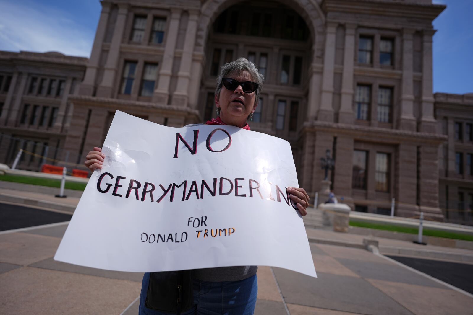 Demonstrators gather outside the Texas Capitol as the House calls a Special Session, Monday, July 21, 2025, in Austin. (AP Photo/Eric Gay)