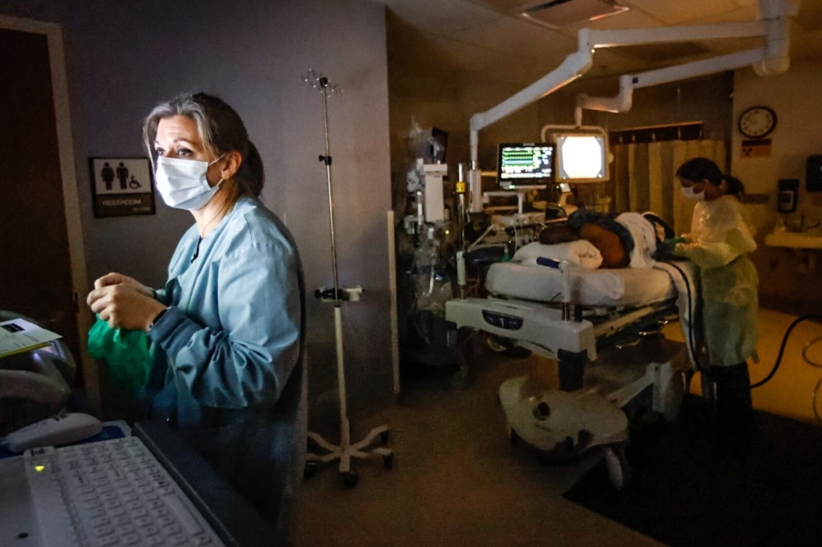 Dayton VA Medical Center RN, Emily Laux, left, works with Dr. Sangeeta Agrawal to perform a colonoscopy using artificial intelligence to detect polyps in the colon. JIM NOELKER/STAFF