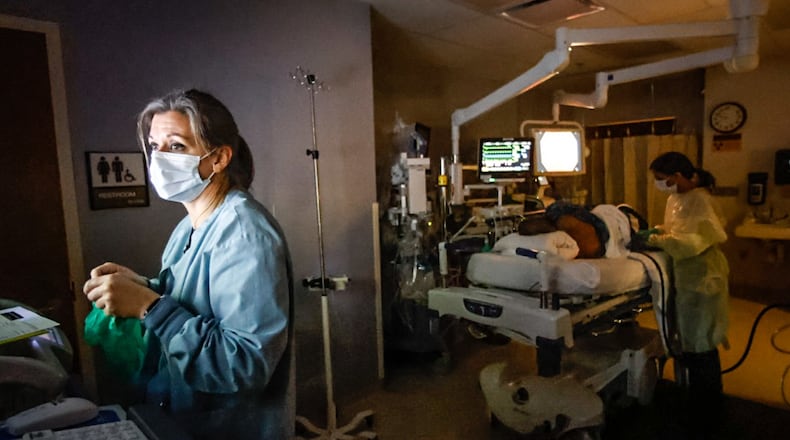 Dayton VA Medical Center RN, Emily Laux, left, works with Dr. Sangeeta Agrawal to perform a colonoscopy using artificial intelligence to detect polyps in the colon. JIM NOELKER/STAFF