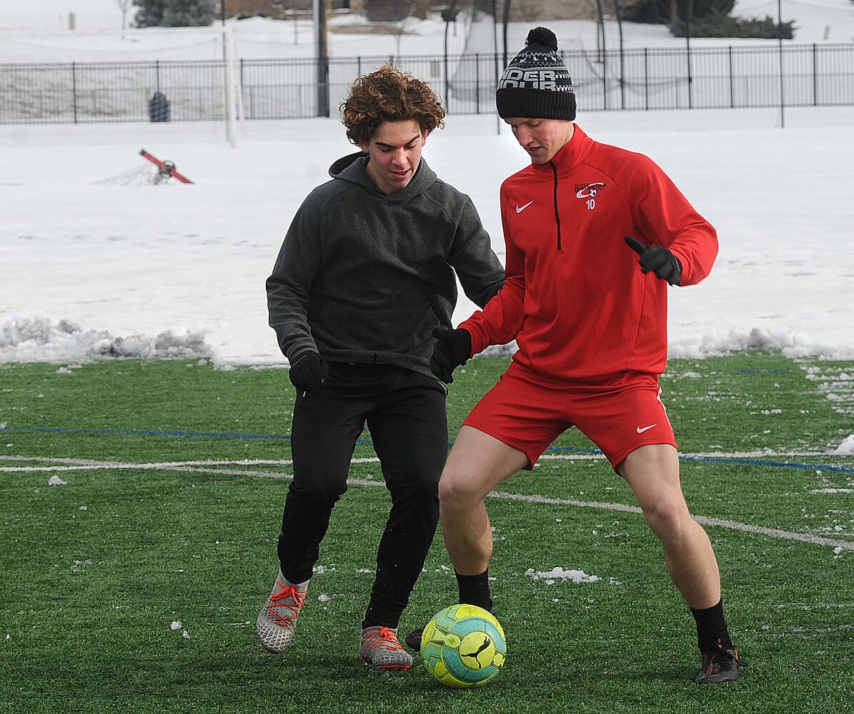 PHOTOS: Oakwood soccer players shovel snow to play