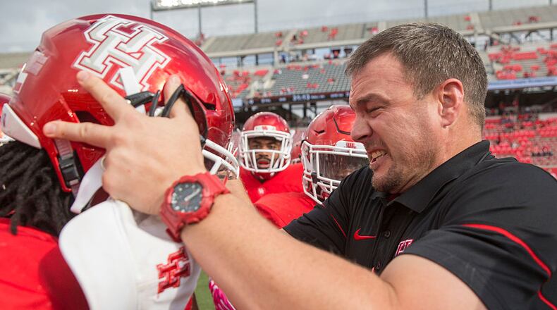 HOUSTON, TX - OCTOBER 29: Tom Herman Head Coach of the University of Houston reacts after head banging a player's helmet as he fires the team up on the field before their game against the University of Central Florida at TDECU Stadium on October 29, 2016 in Houston, Texas. (Photo by Richard Carson/Getty Images)