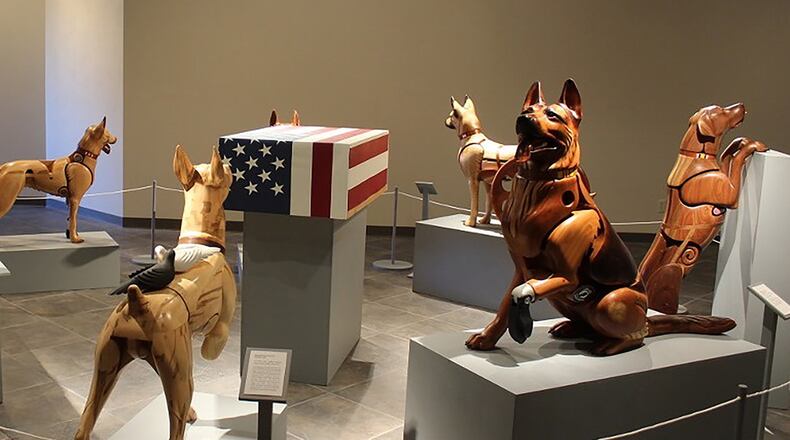 A temporary exhibit featuring wounded warrior dog wooden sculptures by artist James Mellick is on display at the National Museum of the U.S. Air Force through Jan. 31. (Contributed photo)