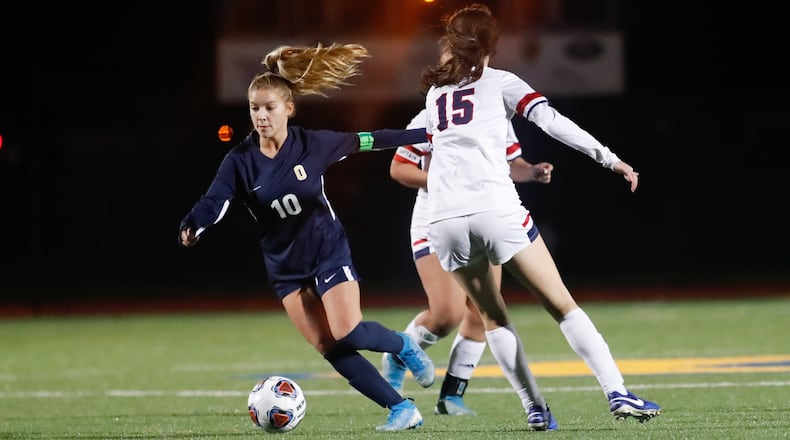 Cutline: Oakwood High School senior Riley Beam dribbles the ball during their game against Columbus Bishop Hartley on Tuesday night at Lane Stadium. Oakwood won 2-0. CONTRIBUTED PHOTO BY MICHAEL COOPER