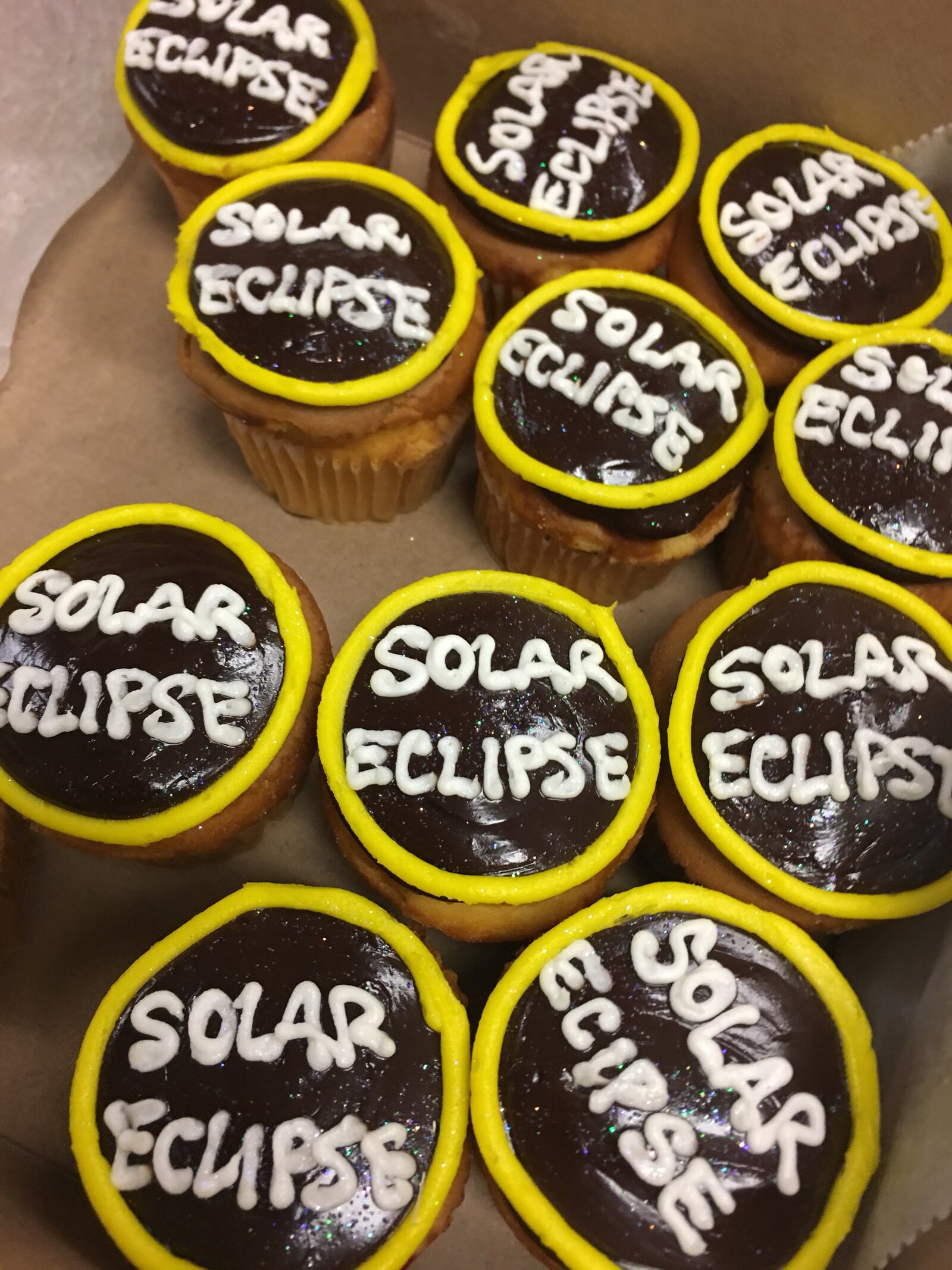 These solar eclipse cupcakes from Ashley's Pastry Shop in Oakwood are available now through Monday while supplies last for $1.85. ALLEGRA CZERWINSKI/STAFF