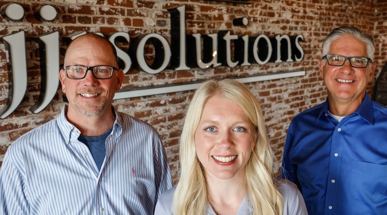 From left, Dave Judson, C.E.O., Carly Cox President & C.O.O. and Dan Marion C.M.O. of JJR Solutions are based in Dayton with offices in Washington D.C. and Colorado Springs. JIM NOELKER/STAFF