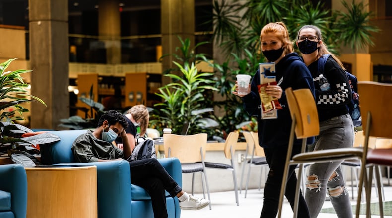 Sinclair College students study in the school's library Wednesday Sept, 15, 2021. JIM NOELKER/STAFF