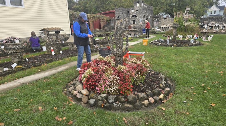 Volunteers at the Hartman Rock Garden in Springfield prepare the flower beds for winter. This gives them a head start on spring. CONTRIBUTED