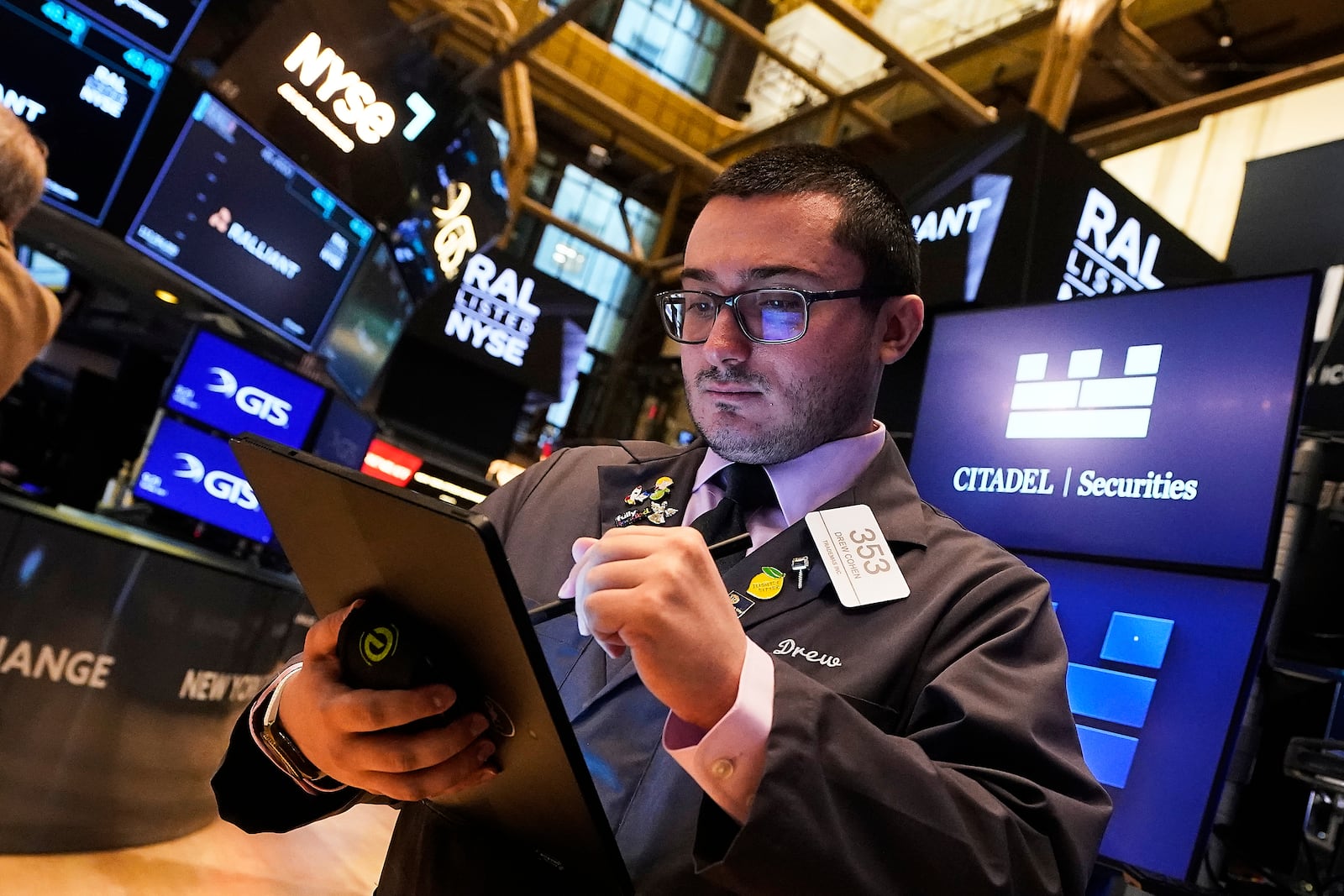 Trader Drew Cohen works on the floor of the New York Stock Exchange, Tuesday, July 1, 2025. (AP Photo/Richard Drew)